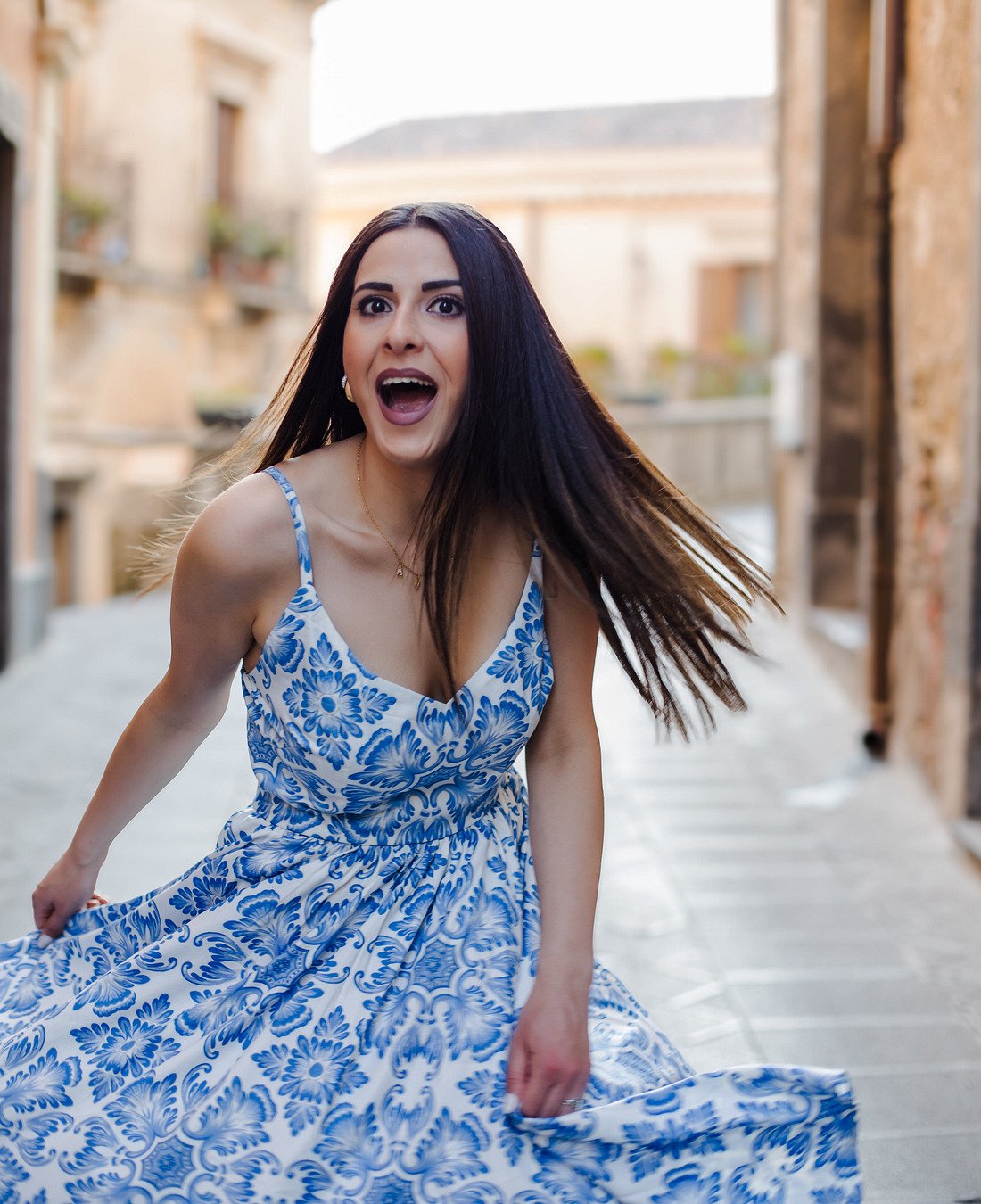 Model wearing a blue floral BANEE BANEE dress